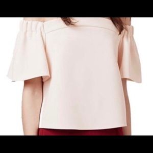 Light pink off the shoulder shirt